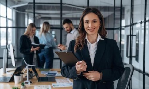 a-business-woman-is-standing-in-front-of-a-group-of-people-photo